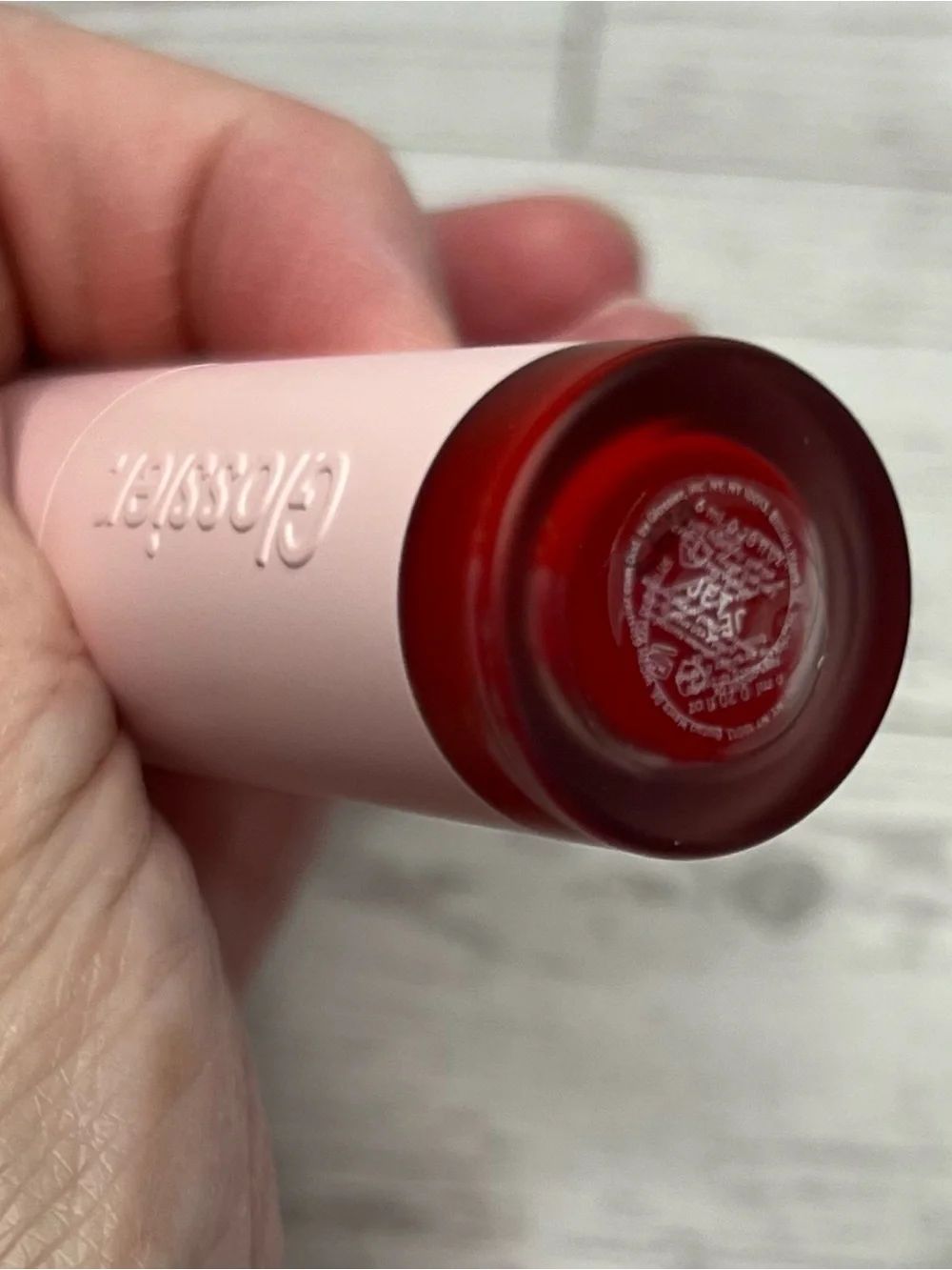 Glossier G suit, soft touch lip cream, shade JET